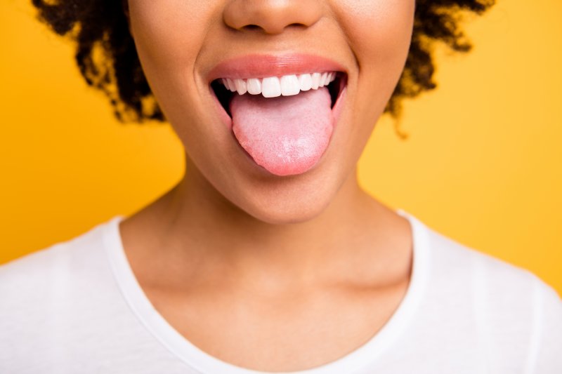 young woman sticking tongue out