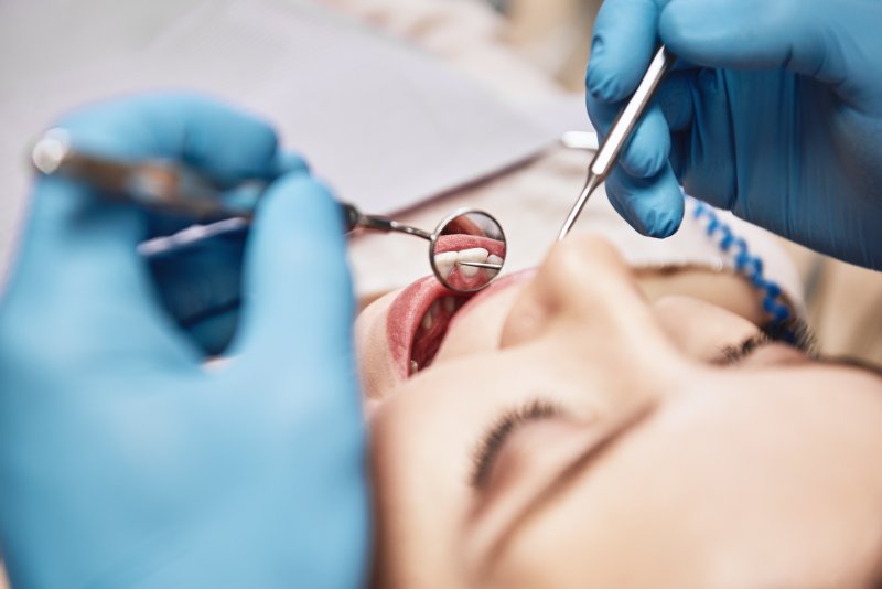 dentist conducting routine checkup 